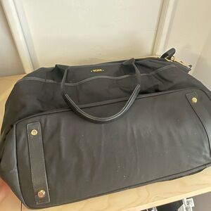Like new Tumi Voyager travel bag in the color black